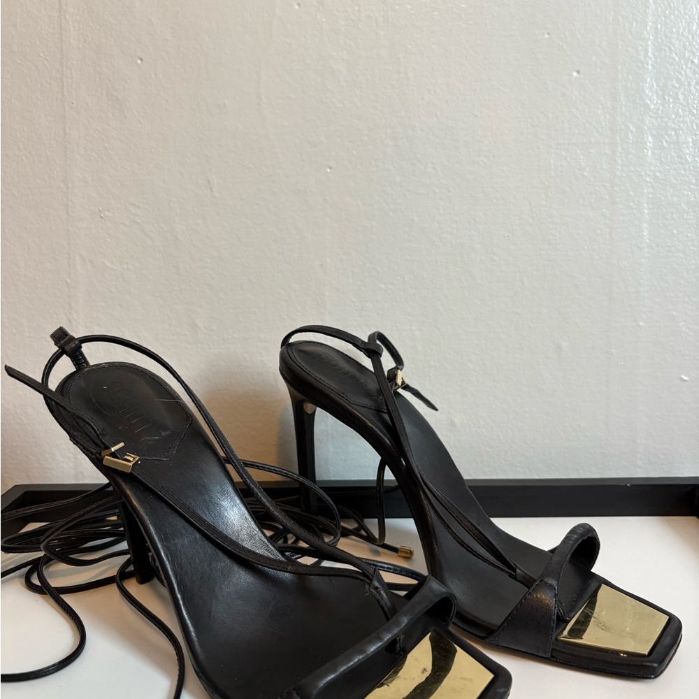 SCHUTZ Black and Gold Strappy Heels